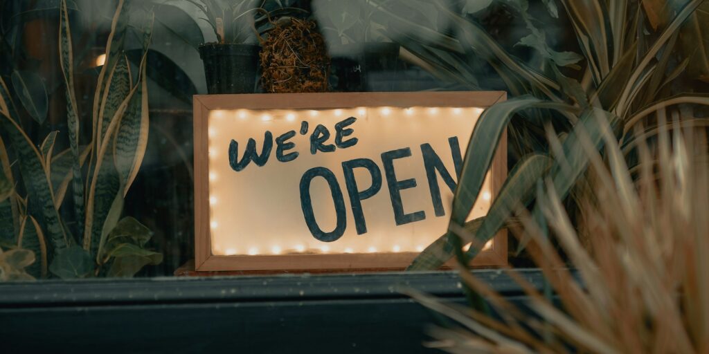 Lit open sign in a shop window